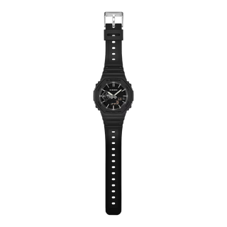 G-SHOCK GA-2100LXB-1A Watch in Black/Gold — CasiOak silhouette with carbon core guard structure, black IP stainless steel bezel, gold-tone accents, analog-digital display, 200M water resistant