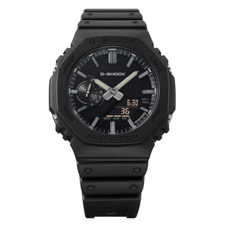 G-SHOCK GA-2100LXB-1A Watch in Black/Gold — CasiOak silhouette with carbon core guard structure, black IP stainless steel bezel, gold-tone accents, analog-digital display, 200M water resistant