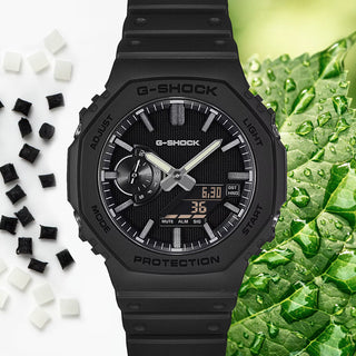 G-SHOCK GA-2100LXB-1A Watch in Black/Gold — CasiOak silhouette with carbon core guard structure, black IP stainless steel bezel, gold-tone accents, analog-digital display, 200M water resistant