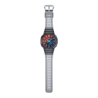 GA-2100TLS-8A G-Shock watch in translucent grey and orange with iridescent glass and durable shock-resistant construction.