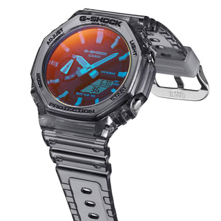 GA-2100TLS-8A G-Shock watch in translucent grey and orange with iridescent glass and durable shock-resistant construction.
