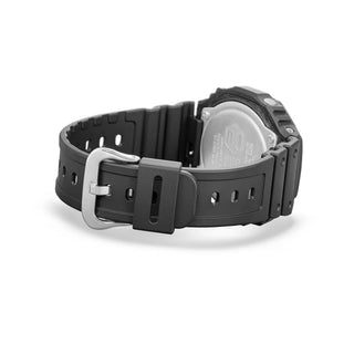 Black Casio watch with a silver buckle on a white background
