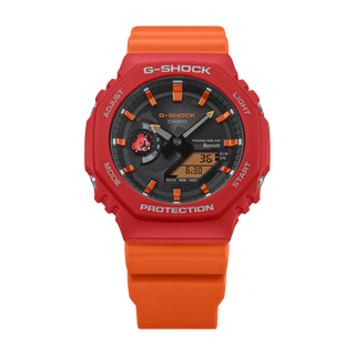 Black and red-orange G-Shock GAB2100DF-4A watch with crab-inspired accents, octagonal case, and Galápagos island dial graphic.