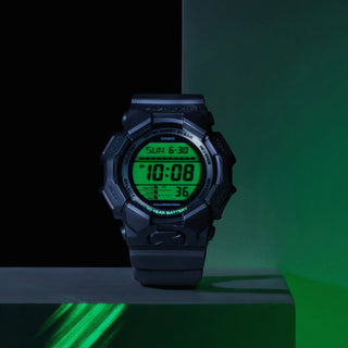 G-SHOCK GD010BEG-1 digital watch with black bio-based case, electro green display accents, and resin band.
