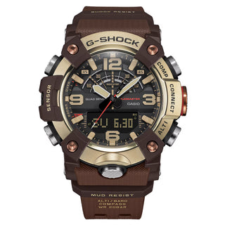 Front view of the G-SHOCK GGB100XMH-5A Mudmaster with a gold-tone bezel, dark brown case and band, black analog-digital dial, and red second hand