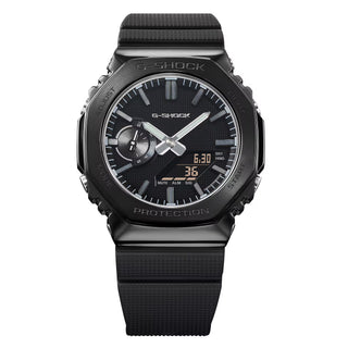 G-SHOCK GM-2100LXB-1A Watch in Black/Gold — CasiOak silhouette with stainless steel case, carbon core guard structure, black IP bezel with gold-tone accents, analog-digital display, 200M water resistant
