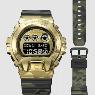 "G-Shock GM6900CMG-3 Bold Camo Gold Watch — gold-colored metal bezel, gold dial, camo printed band with hidden G-mark, classic 6900 silhouette"