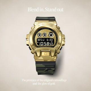 "G-Shock GM6900CMG-3 Bold Camo Gold Watch — gold-colored metal bezel, gold dial, camo printed band with hidden G-mark, classic 6900 silhouette"