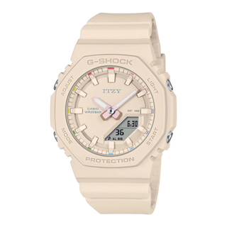 Beige G-SHOCK x Itzy watch, colorful dial indices, bio-based resin band.