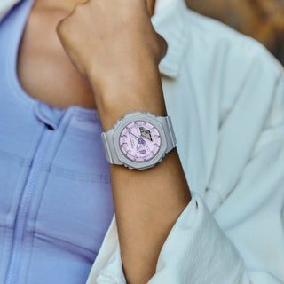 G-SHOCK GMAS2100NC8A analog-digital watch in grey and light purple, with bio-based resin band and basil leaf indicator.
