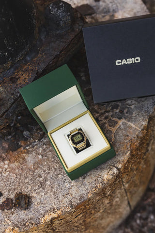 Casio watch in a green box on a stone surface