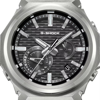 G-SHOCK GSTB1000-1A with a silver-tone metal bezel, black brick-pattern dial, silver-tone hands and markers, and black band