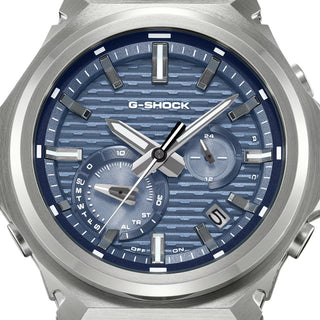 G-SHOCK GSTB1000-2A with a silver-tone metal bezel, blue brick-pattern dial, silver-tone hands and markers, and black band