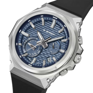 G-SHOCK GSTB1000-2A with a silver-tone metal bezel, blue brick-pattern dial, silver-tone hands and markers, and black band