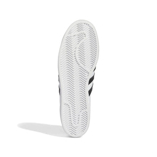 White sneaker sole with black stripes on a white background