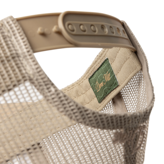 Dime Vortex Trucker Cap in Sand with debossed logo and snapback closure.