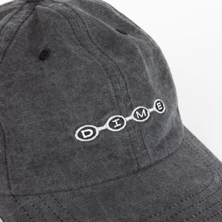 Dime Space Low Pro Cap in Black Washed — stone-washed 100% cotton low-profile snapback with embroidered logos on front crown and back, and cotton sweatband