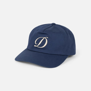 Angled front view of Dime Cursive D Worker Cap in Marine blue with a raised cream embroidered cursive D logo and curved brim