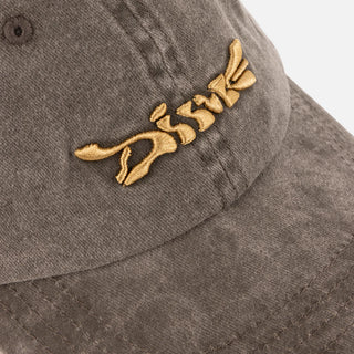 Khaki washed Dime low-profile cap with front poster graphic.