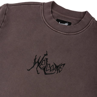 Raisin-colored heavyweight crewneck with Welcome Skateboards spine embroidery, elastic ribbing.