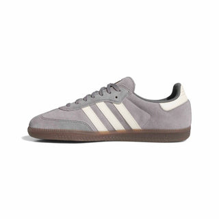 Gray Adidas sneaker with white stripes on a white background