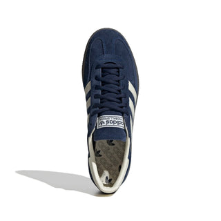 Navy blue Adidas sneaker with white stripes on a white background