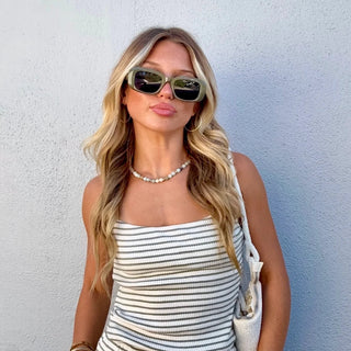  Billabong Easy Livin Cami in Army Green — fitted rib knit cami with straight neckline, interior shelf bra, adjustable straps, and metal logo plate in stretchy cotton blend