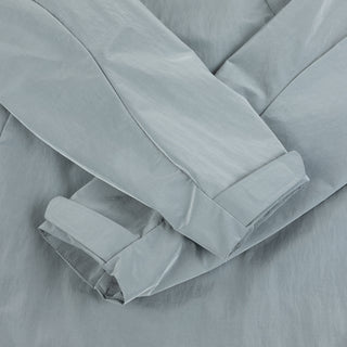 Glossy Dime Taffeta Windbreaker with zip pockets and reflective logo