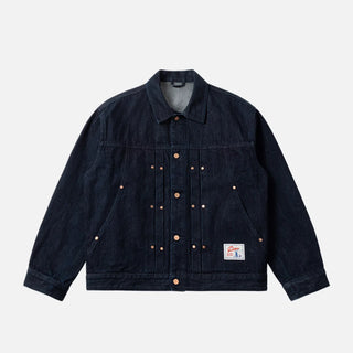 Dime Pleated Denim Jacket in Indigo — 100% cotton with front pleats, custom shanks, hexagon rivets, metal button closure, and woven label branding at hem