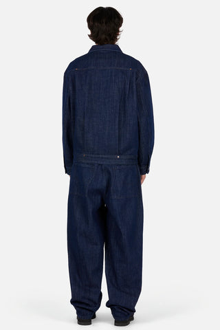 Dime Pleated Denim Jacket in Indigo — 100% cotton with front pleats, custom shanks, hexagon rivets, metal button closure, and woven label branding at hem