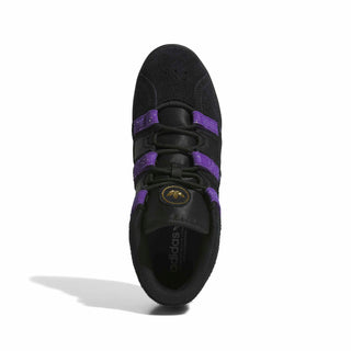 Side view of the adidas Skateboarding Kader shoe in Core Black with Collegiate Purple stripes and Gold Metallic Kader lettering