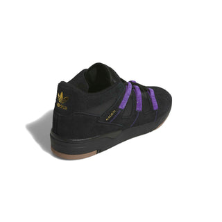 Side view of the adidas Skateboarding Kader shoe in Core Black with Collegiate Purple stripes and Gold Metallic Kader lettering