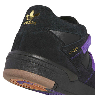 Side view of the adidas Skateboarding Kader shoe in Core Black with Collegiate Purple stripes and Gold Metallic Kader lettering