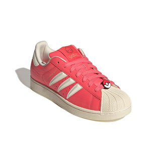 adidas Originals Pokémon Superstar II "Charmeleon" in Preloved Scarlet/Preloved Scarlet/Cream White — full leather upper with Charmeleon scale-like skin texture, 3-Stripes shaped into claws, Charmeleon character on tongue label, sockliner, and lace jewel