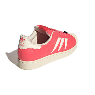 adidas Originals Pokémon Superstar II "Charmeleon" in Preloved Scarlet/Preloved Scarlet/Cream White — full leather upper with Charmeleon scale-like skin texture, 3-Stripes shaped into claws, Charmeleon character on tongue label, sockliner, and lace jewel