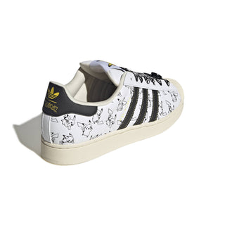 adidas Originals Pokémon Superstar II "Pikachu" in Footwear White/Core Black/Gold Metallic — leather upper with shelltoe design, Pikachu character visuals, Pokéball laces, Pikachu tail lace jewel, padded tongue and heel, rubber outsole