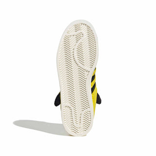 adidas Originals Pokémon Superstar II "Pikachu" in Yellow/Yellow/Core Black — yellow furry upper, Pikachu tail lace jewel, Pikachu ears on tongue, full textile lining and rubber outsole on the classic Superstar II silhouette