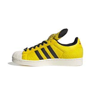 adidas Originals Pokémon Superstar II "Pikachu" in Yellow/Yellow/Core Black — yellow furry upper, Pikachu tail lace jewel, Pikachu ears on tongue, full textile lining and rubber outsole on the classic Superstar II silhouette