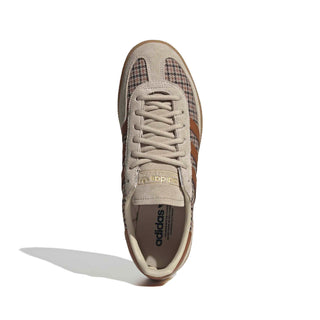 Close-up of adidas Originals Handball Spezial in Beige/Khaki Three/Dusky Bronze showing houndstooth fabric, brown stripes, gold Spezial branding, and a gum sole.