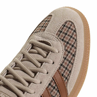 Close-up of adidas Originals Handball Spezial in Beige/Khaki Three/Dusky Bronze showing houndstooth fabric, brown stripes, gold Spezial branding, and a gum sole.