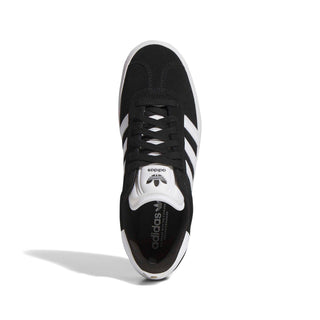 Adidas Gazelle ADV skate shoe in Core Black, Cloud White, and Gold Metallic — low-profile suede upper with cupsole construction and reinforced ollie zone.