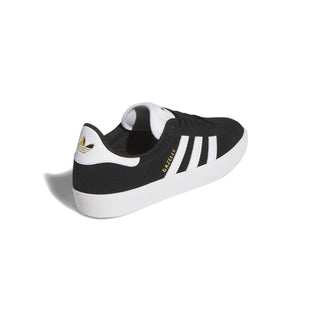 Adidas Gazelle ADV skate shoe in Core Black, Cloud White, and Gold Metallic — low-profile suede upper with cupsole construction and reinforced ollie zone.