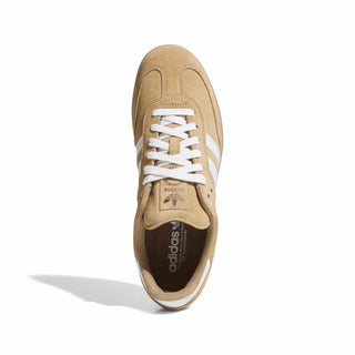 Beige Adidas sneaker with white laces on a white background