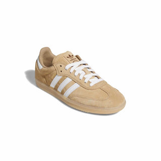 Beige Adidas sneaker with white stripes on a white background