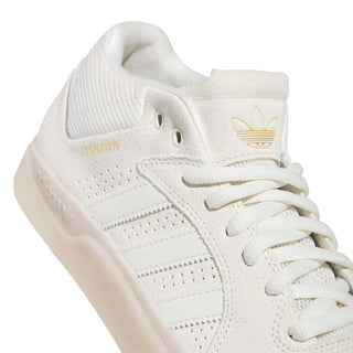 adidas Skateboarding Tyshawn Shoes in Off White/Gold Metallic — Tyshawn Jones signature skate shoe with leather upper, Adituff toe reinforcement, Adiprene sockliner, and EVA midsole