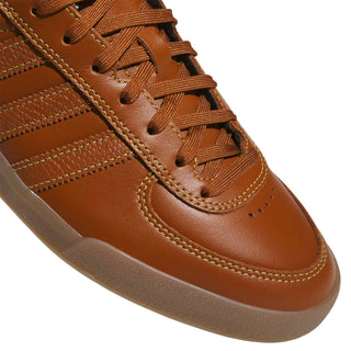 adidas Skateboarding Glenburn Shoes in Dusky Bronze/Gold Metallic/Gum — terrace-inspired skate shoe with leather upper, EVA heel cushioning, Three Stripes branding, and rubber outsole
