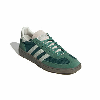 adidas Originals Handball Spezial in Collegiate Green/Linen Green — textile and mesh upper with suede overlays, snakeskin pattern detail, OG Spezial branding, and rubber outsole rooted in the 1979 heritage.