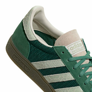 adidas Originals Handball Spezial in Collegiate Green/Linen Green — textile and mesh upper with suede overlays, snakeskin pattern detail, OG Spezial branding, and rubber outsole rooted in the 1979 heritage.