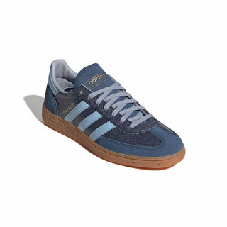 adidas Originals Handball Spezial in Night Indigo/Clear Sky — cracked leather quarter with suede overlays, patent leather stripes, and soft gum rubber outsole rooted in the original 1979 design.

