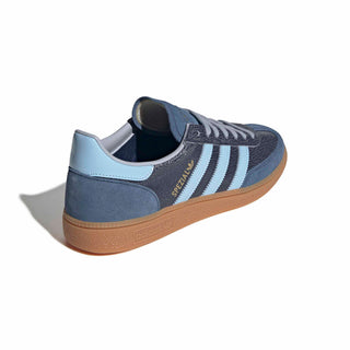 adidas Originals Handball Spezial in Night Indigo/Clear Sky — cracked leather quarter with suede overlays, patent leather stripes, and soft gum rubber outsole rooted in the original 1979 design.

